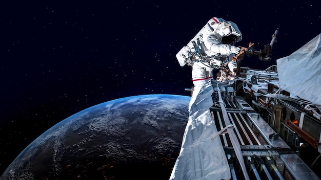 Photo astronaut spaceman do spacewalk while working for spaceflight mission