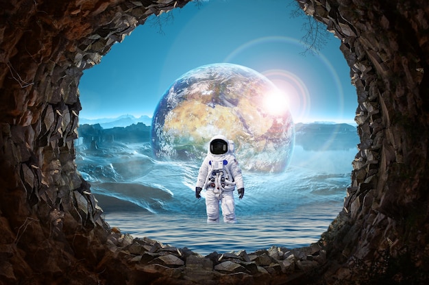 Astronaut  standing in out  Earth Planet  planet Earth and sea