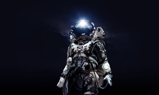 Astronaut in suit against black background. Space technology concept