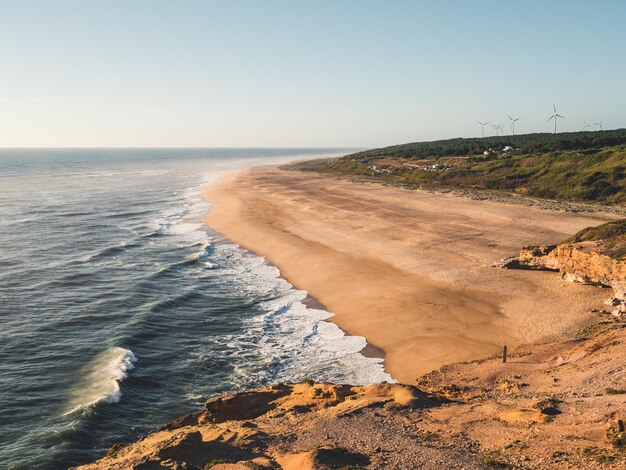 Фото atardecer en la playa de nazaré