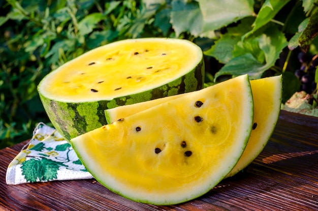 Atermelon with yellow pulp on the table