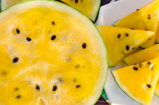 Atermelon with yellow pulp on the table