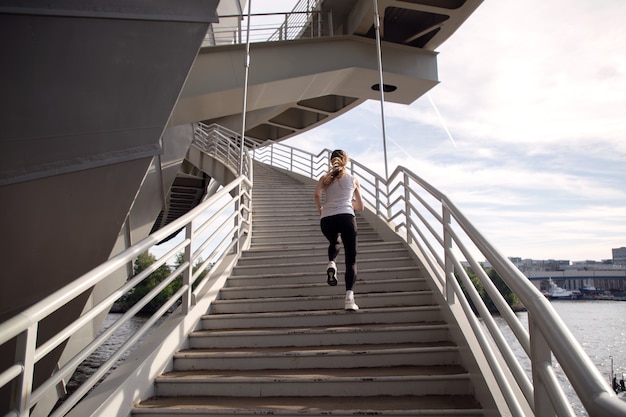 Athlete conducts strength training on stairs