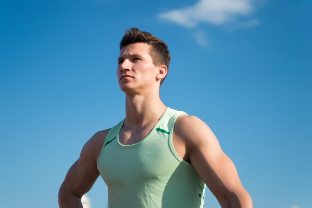 Athlete in green tshirt on sunny day