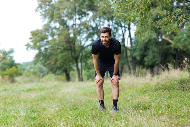 Athlete has severe shortness of breath and chest pain heart aches, man during fitness training and running