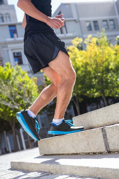 Athlete jogging up the stairs