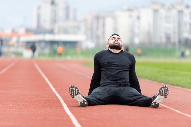 Athlete Man Resting After Running Outside