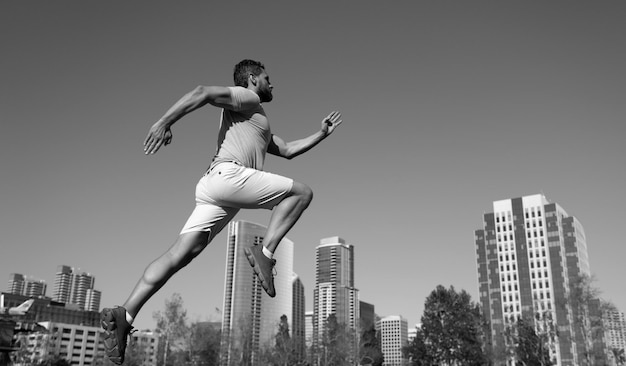 Athlete runner feet running in city park jogging concept at outdoors man running for exercise on cit