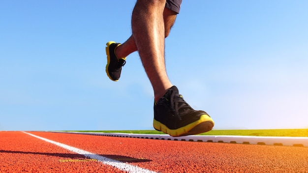 Athlete running on athletic racetrack