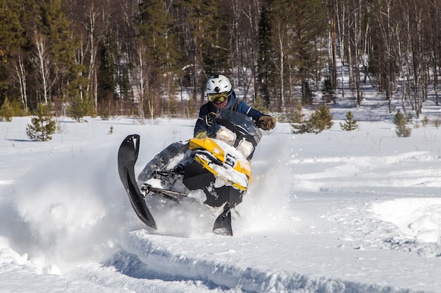 Athlete on a snowmobile.