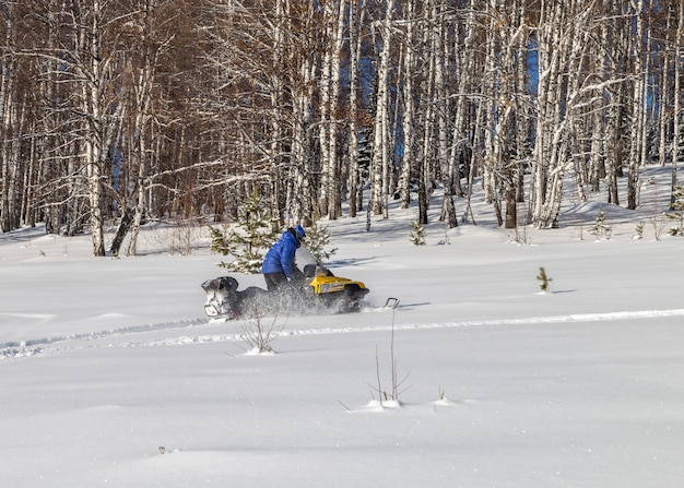 Athlete on a snowmobile.