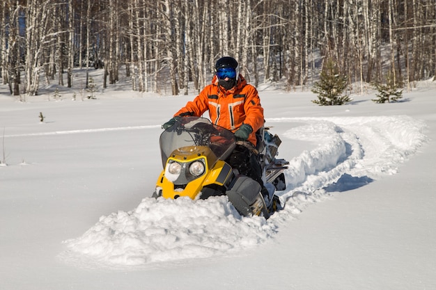 Athlete on a snowmobile.