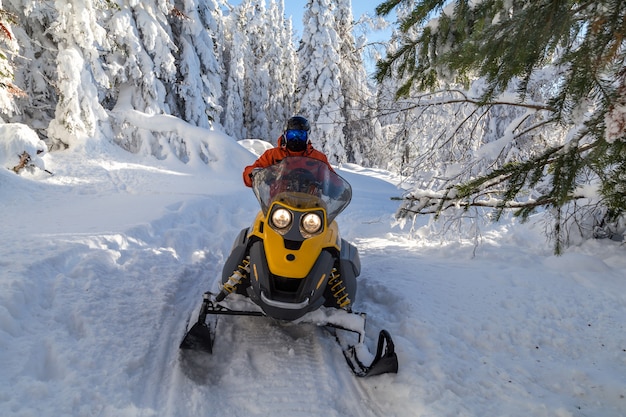 Photo athlete on a snowmobile