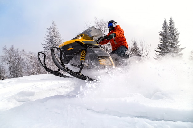 Photo athlete on a snowmobile