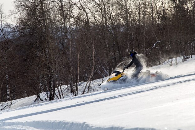 Athlete on a snowmobile