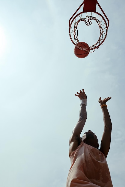 Athlete throwing ball in basket