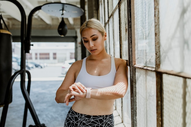 Athlete using a smartwatch in the gym