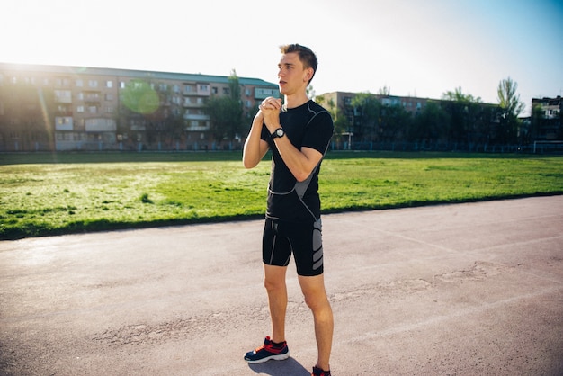 The athlete warming up at the stadium