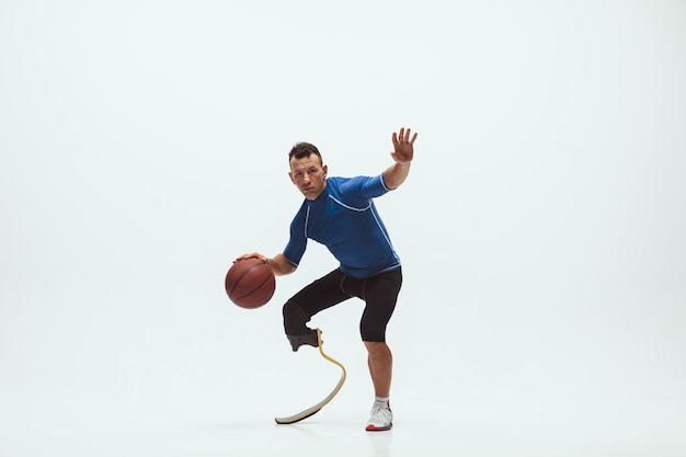 Athlete with disabilities or amputee isolated on white studio background