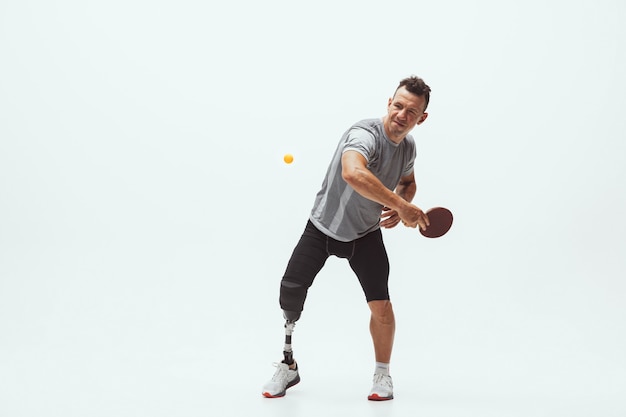 Photo athlete with disabilities or amputee isolated on white studio background