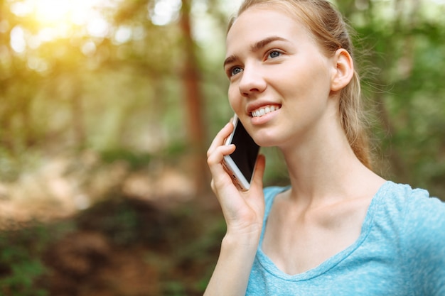 Athlete with a phone in her hands