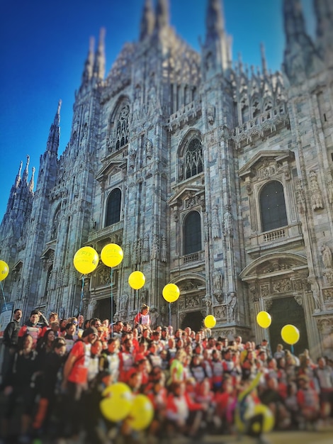 Athletes against cathedral at piazza del duomo