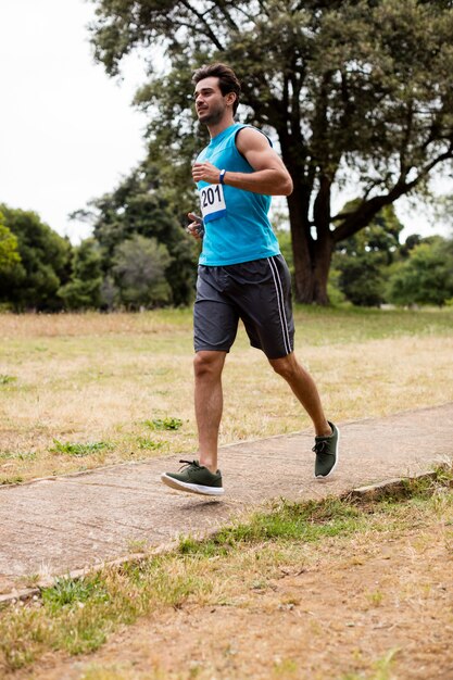 Athletes running race in park