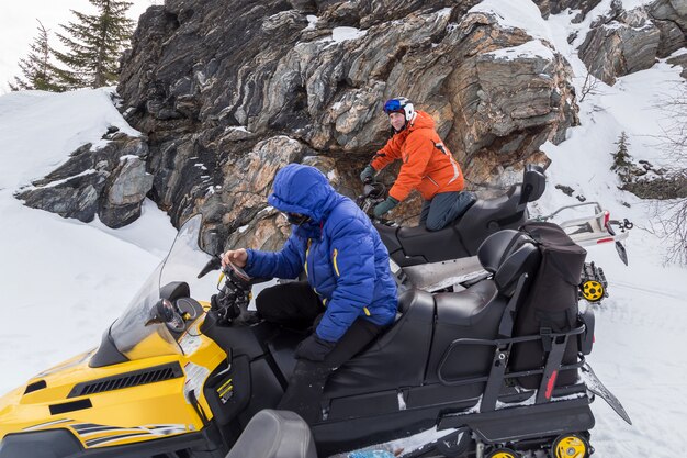 Athletes on a snowmobile