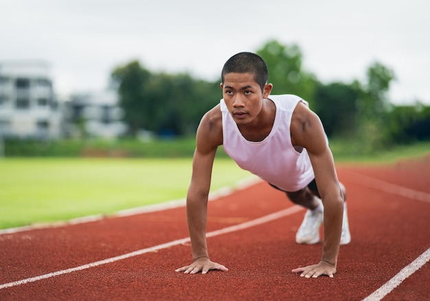 Athletes sport man runner wearing white sportswear to push up, stretching and warm up