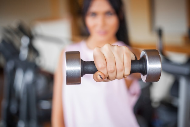 Athletic fitness young woman doing sports exercises