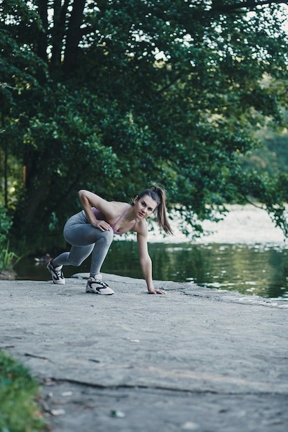 Athletic girl warms up