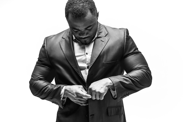 Athletic male African businessman in a suit Black and white shot