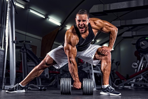 Athletic man doing bent over row muscles