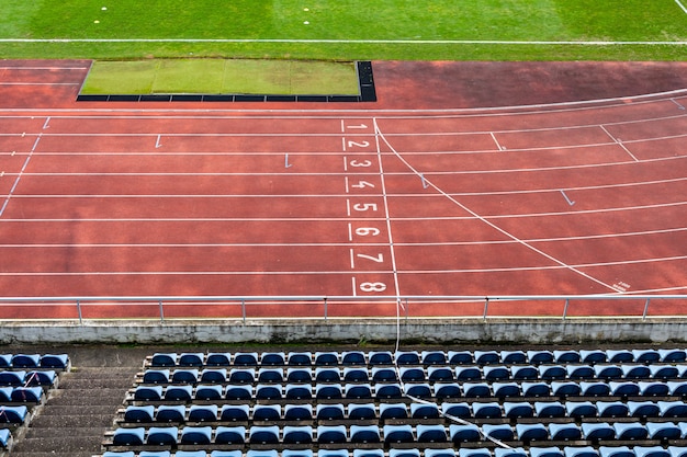 Photo athletic stadium without spectators during a football match at the time of the coronavirus