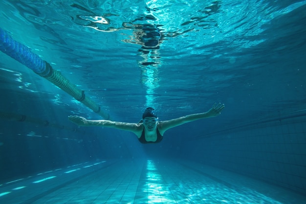 Athletic swimmer training on her own