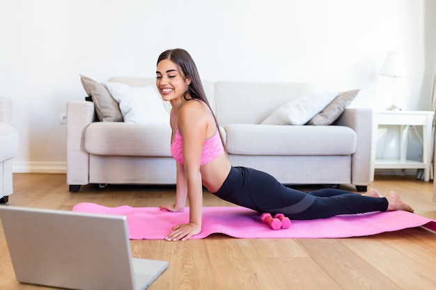 Athletic woman doing exercises on a mattress