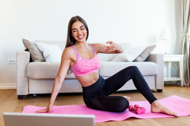 Athletic woman doing exercises on a mattress