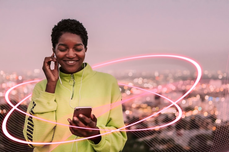 Photo athletic woman listening to music on her phone