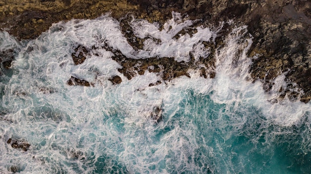 Atlantic ocean with strong swell beating against the rocky cliff south of Tenerife Canary island