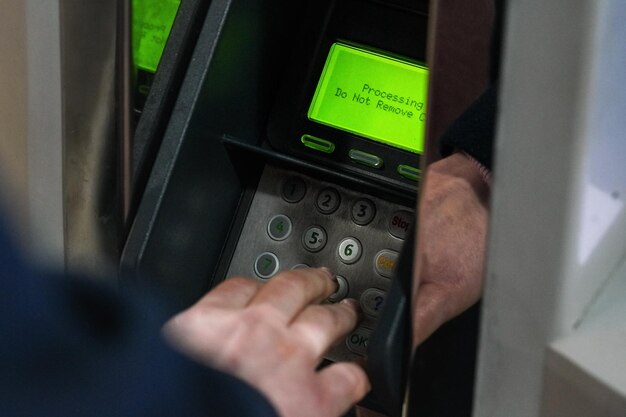 Atm or credit paying terminal with green display showing\
\