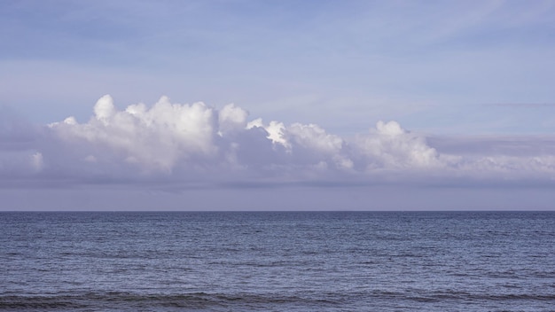 Atmosphere panorama real photo beautiful summer white cloud\
clear pale blue purple tone sky horizon line calm empty sea concept\
paradise life design relax wallpaper background more format in\
stock