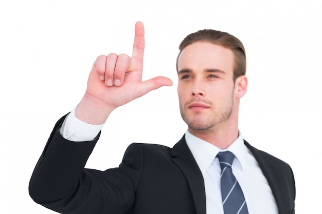 Attentively businessman in suit pointing up 