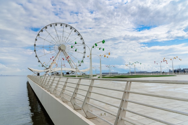 Attraction ferris wheel installed on the embankment of baku seaside boulevard