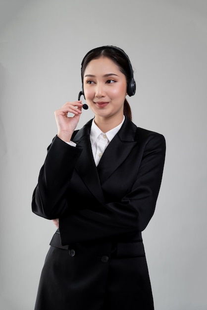 Attractive Asian operator with formal suit and headset Enthusiastic