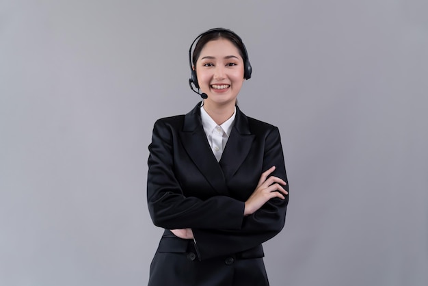 Attractive Asian operator with formal suit and headset Enthusiastic