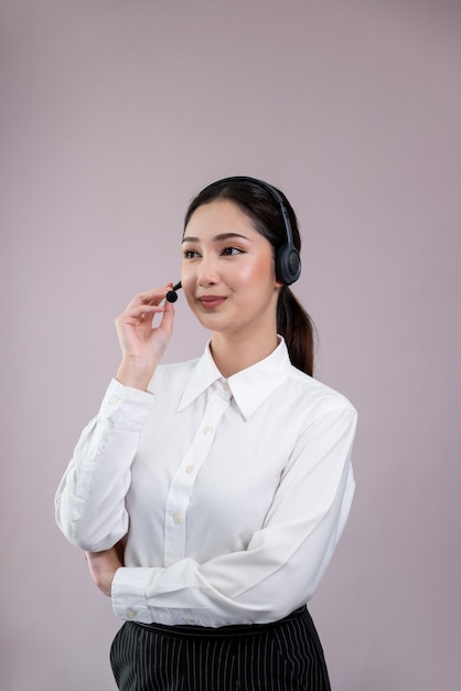 Attractive Asian operator with formal suit and headset Enthusiastic
