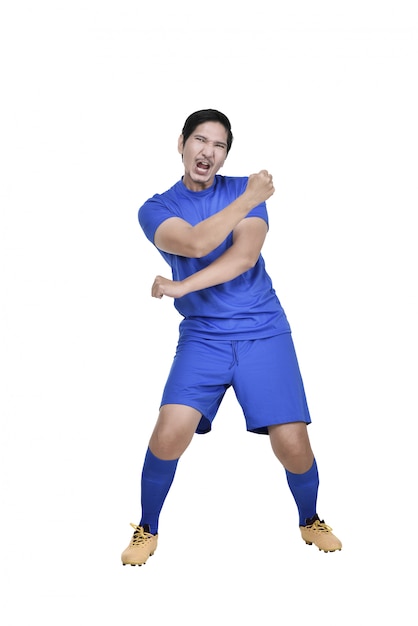 Attractive asian soccer player with excited expression