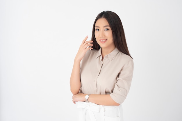 Attractive Asian woman portrait on white wall