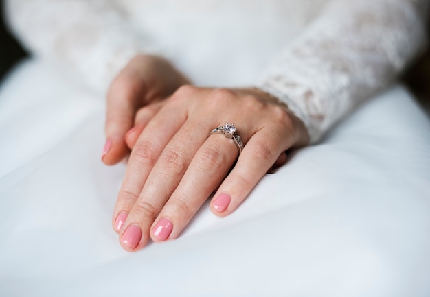 Attractive Beautiful Bride Showing Engagement Wedding Ring on Hand