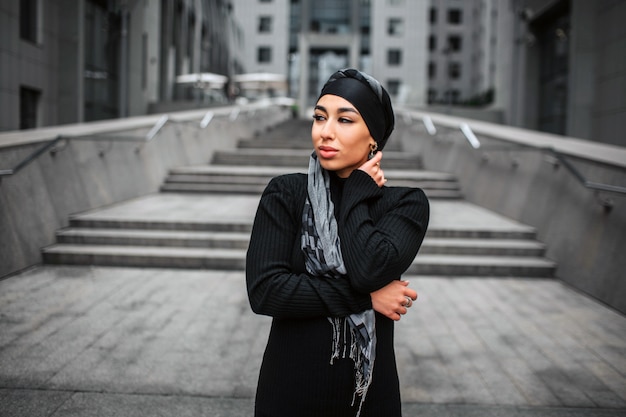 Attractive and beautiful young arabian woman stand in stairs.